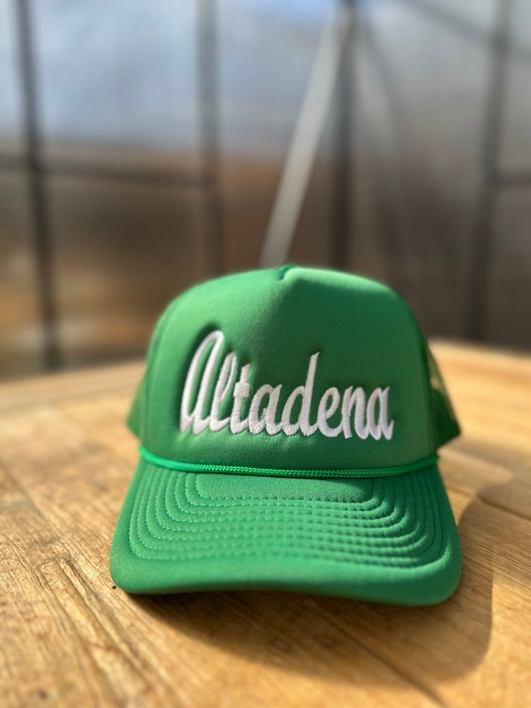 A green hat with the word altadena on it