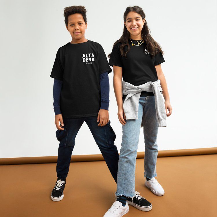 A boy and a girl are standing next to each other