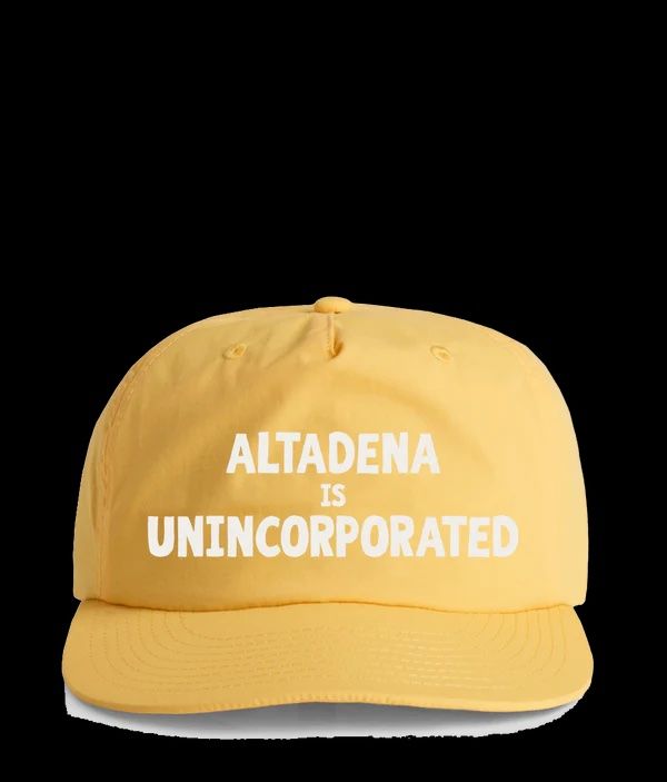 Yellow baseball cap with the white text 