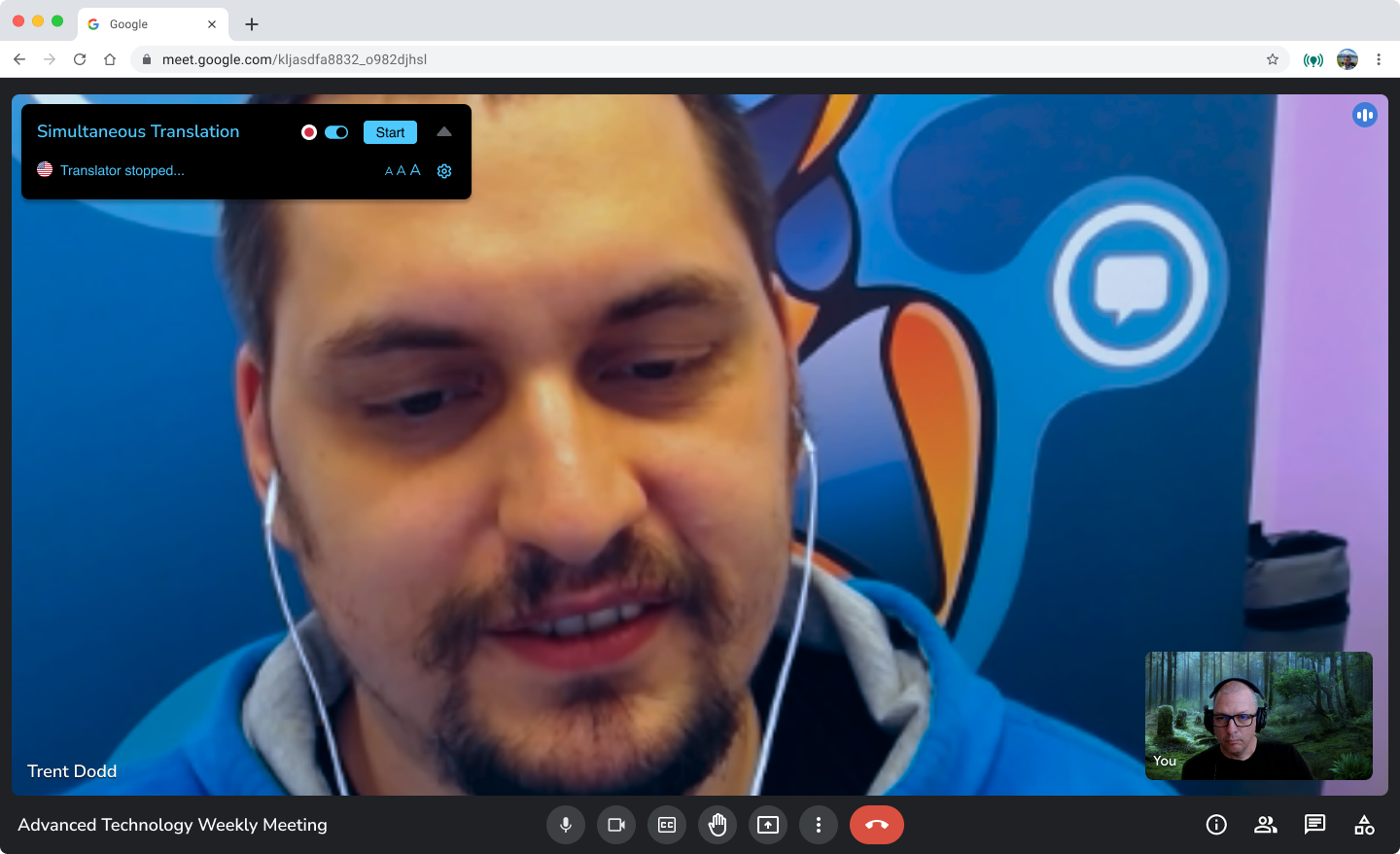 Video call screen showing a man wearing earbuds, with a small participant thumbnail and microphone controls.