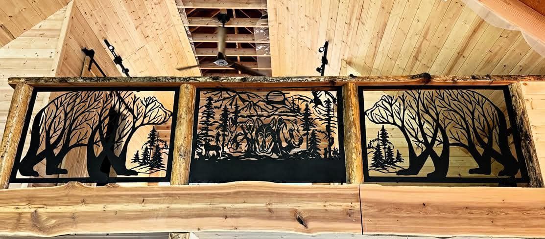 Three framed nature prints hung on a wooden wall inside a rustic room