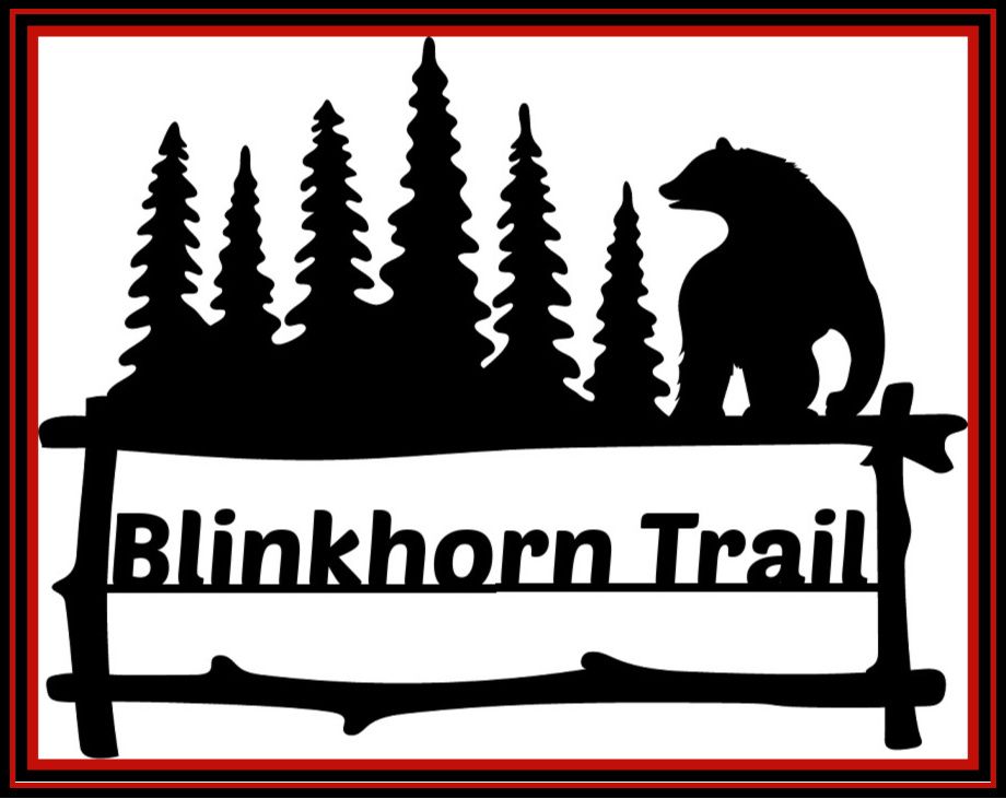Blinkhorn Trail sign with pine trees, a bear silhouette, and a rustic fence border