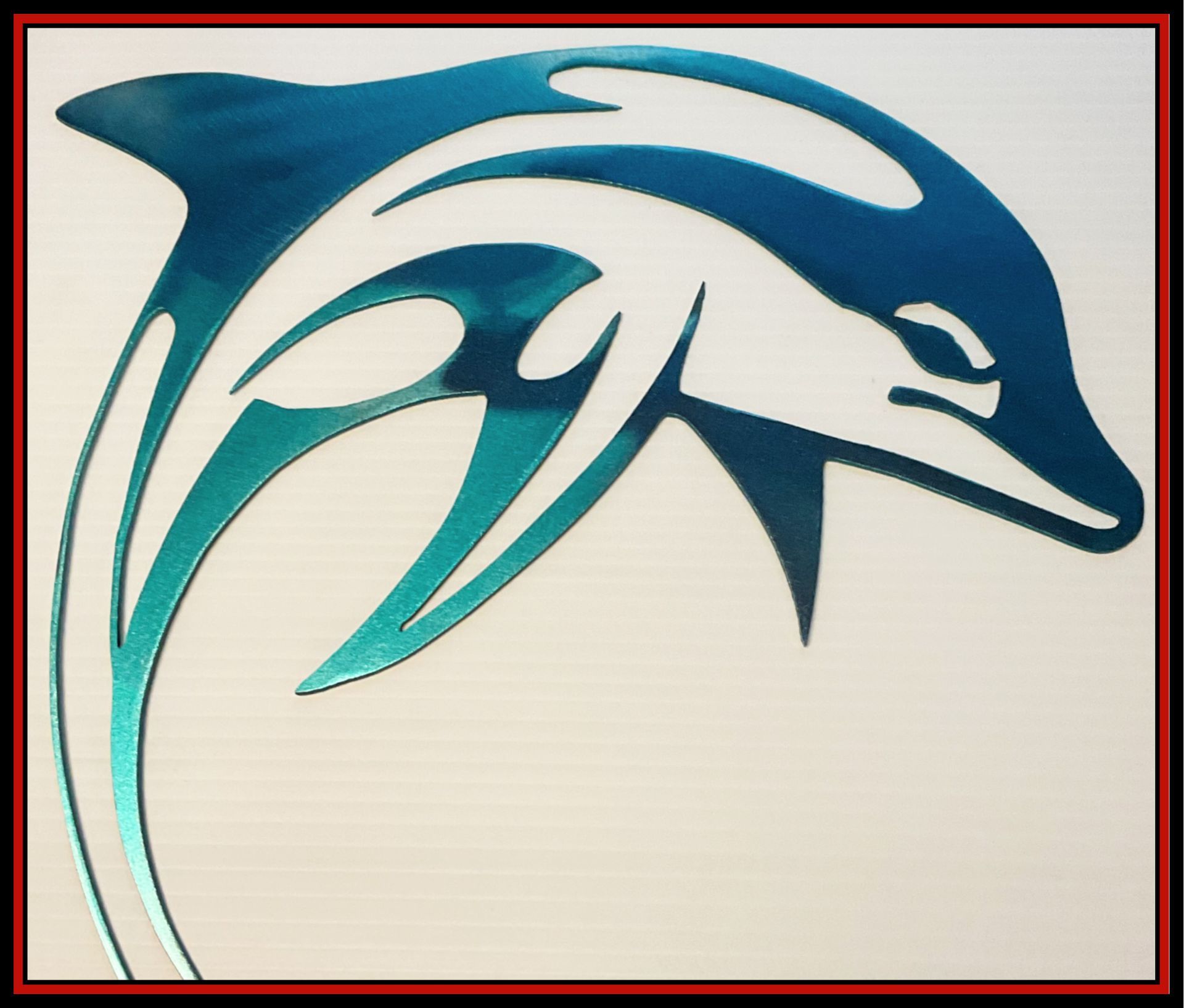 Stylized blue dolphin logo on a light background, outlined by a thin red border