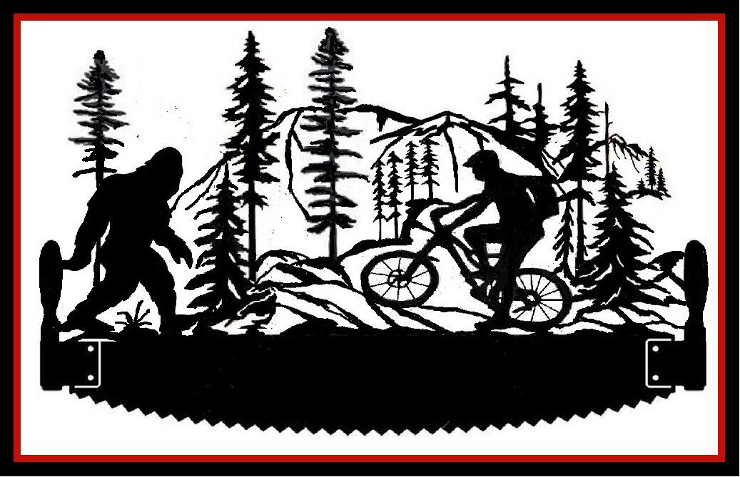 Silhouette of a bicycle with a hiker in a forest scene, framed by pine trees and mountains.