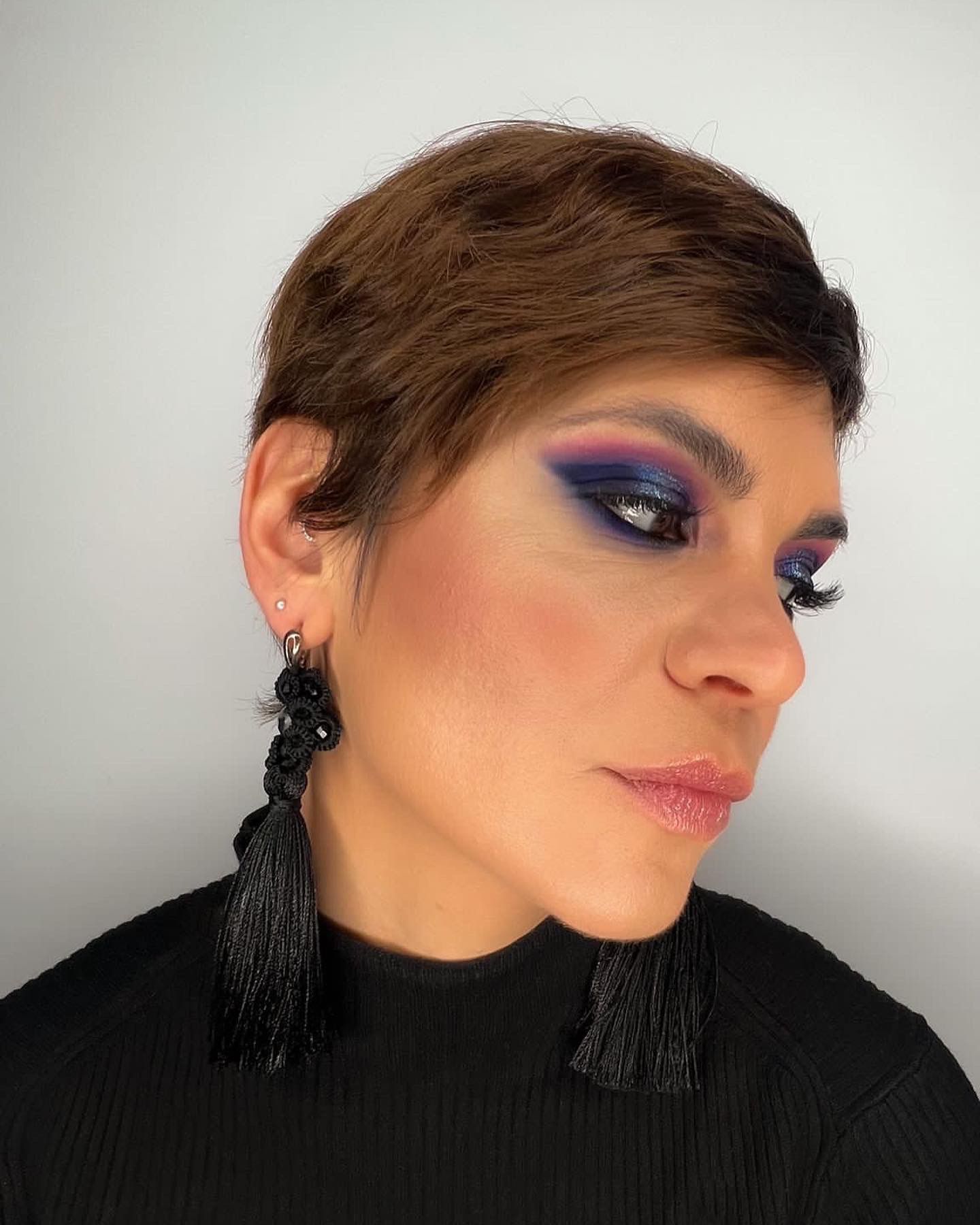 Woman with short hair and smokey eyes