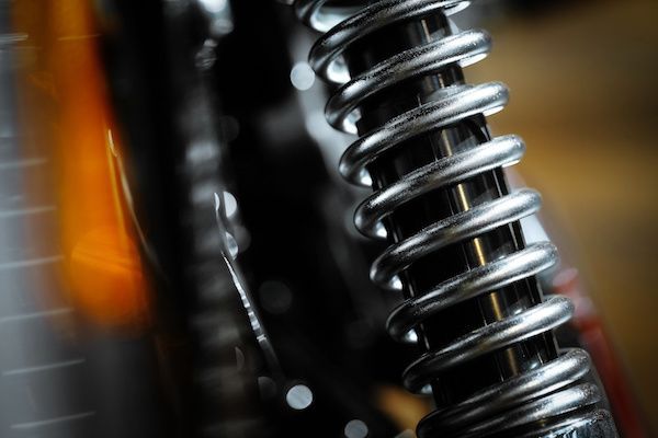 A close up of a shock absorber on a motorcycle. | Lex Brodies 