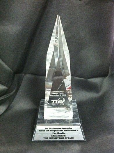 A clear trophy with the word tq on it | Lex Brodies