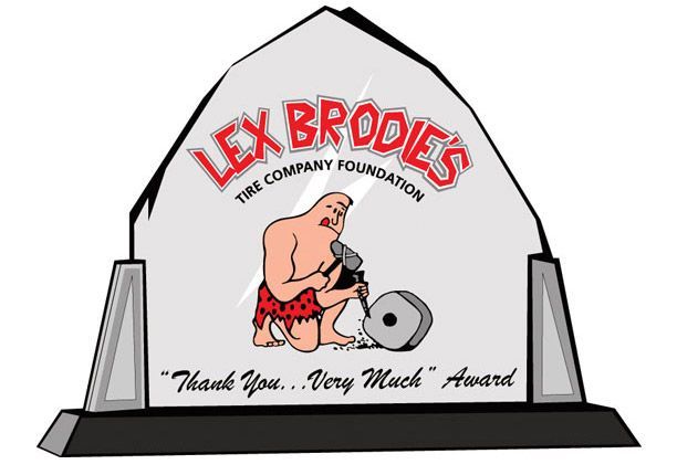 A plaque for lex brodie 's tire company foundation | Lex Brodies