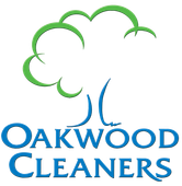A logo for oakwood cleaners with a tree in the middle