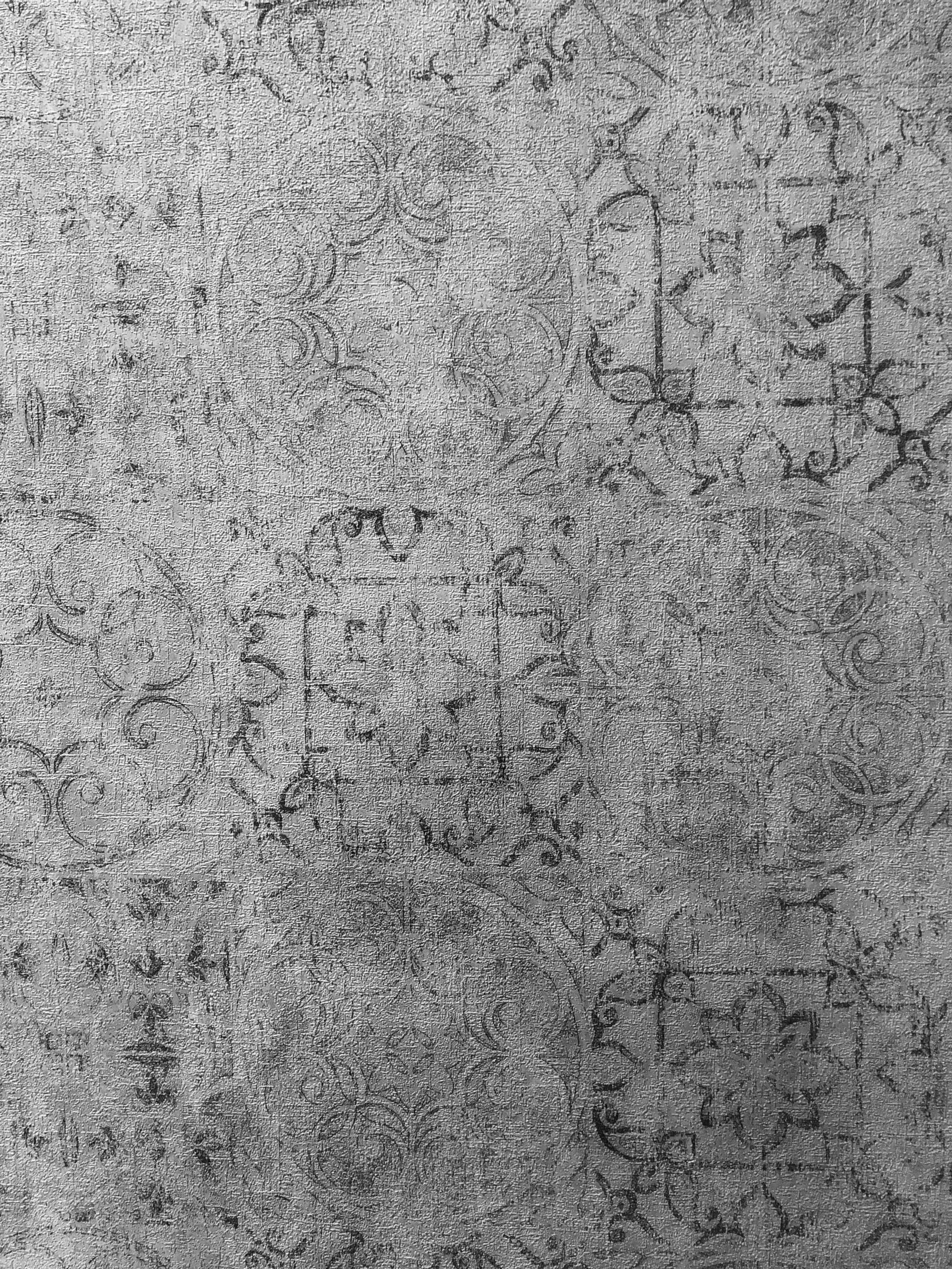 A black and white photo of a gray carpet texture.