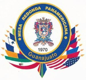 Logo for Mesa Redonda Panamericana in Guanajuato, Mexico, featuring a crest and surrounding flags.