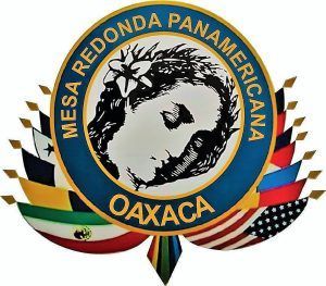 Emblem of Mesa Redonda Panamericana Oaxaca with flags encircling a portrait within a blue circle.