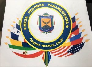 Logo for Mesa Redonda Panamericana, Piedras Negras, Coah., featuring a central emblem and flags from various countries.