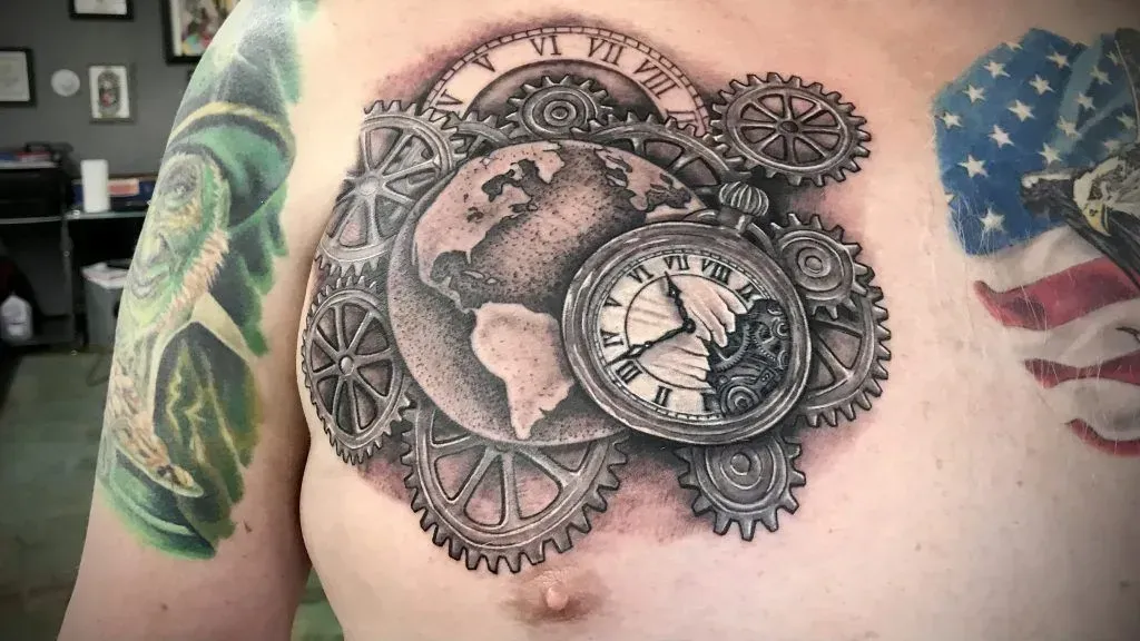 Chest tattoo: Steampunk-style globe, gears, pocket watch with skeletal hands.