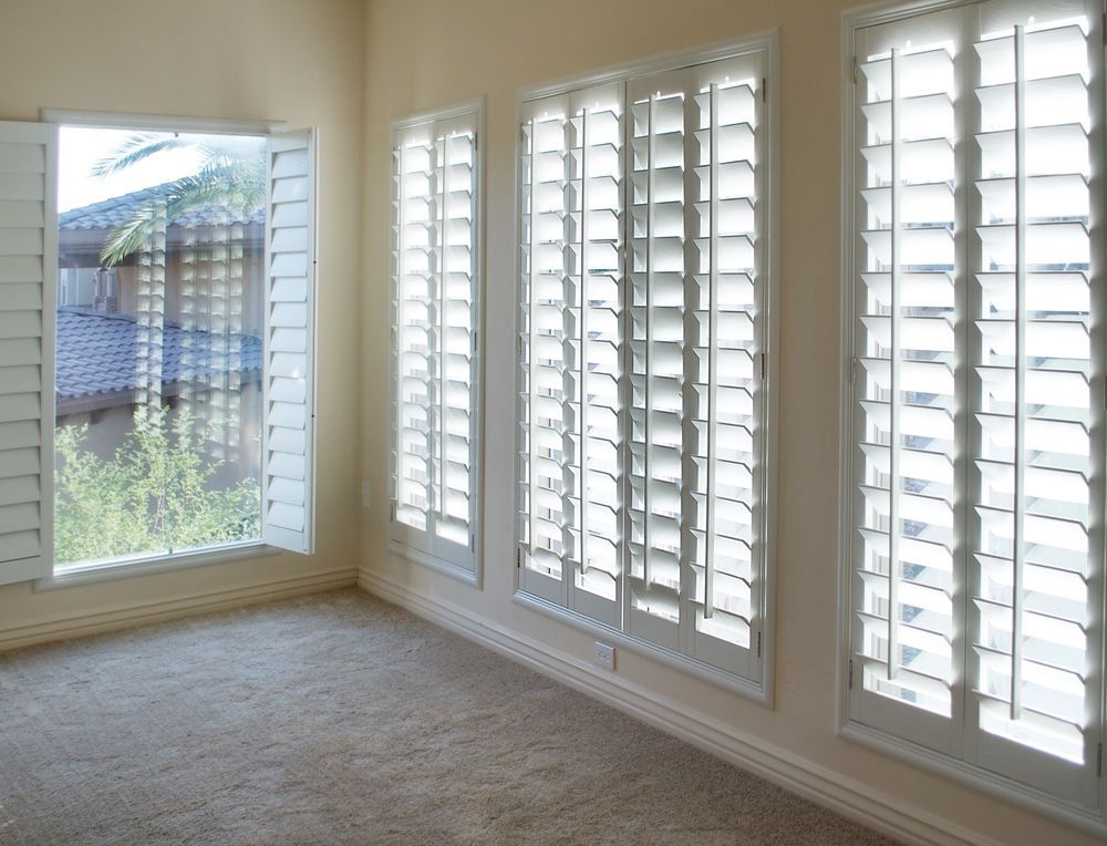 An Empty Room With White Shutters On The Windows — Smith Aluminium In Huntlee, NSW