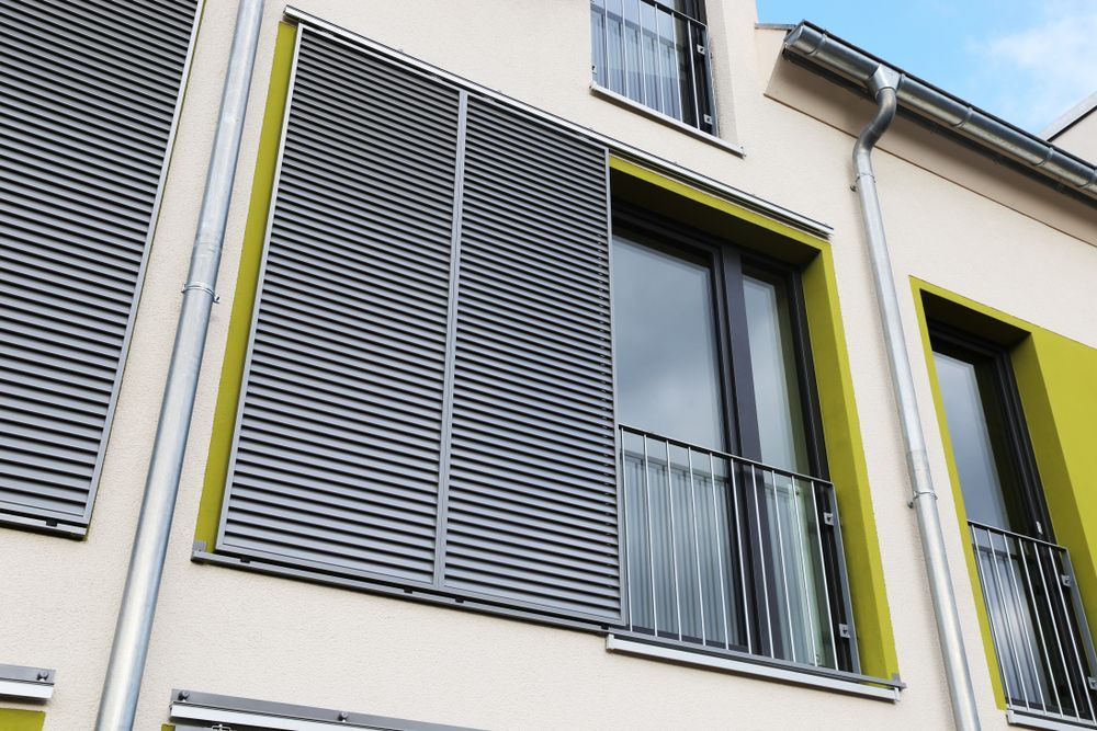 A Building With Sliding Shutters On The Windows — Smith Aluminium In Port Stephens, NSW