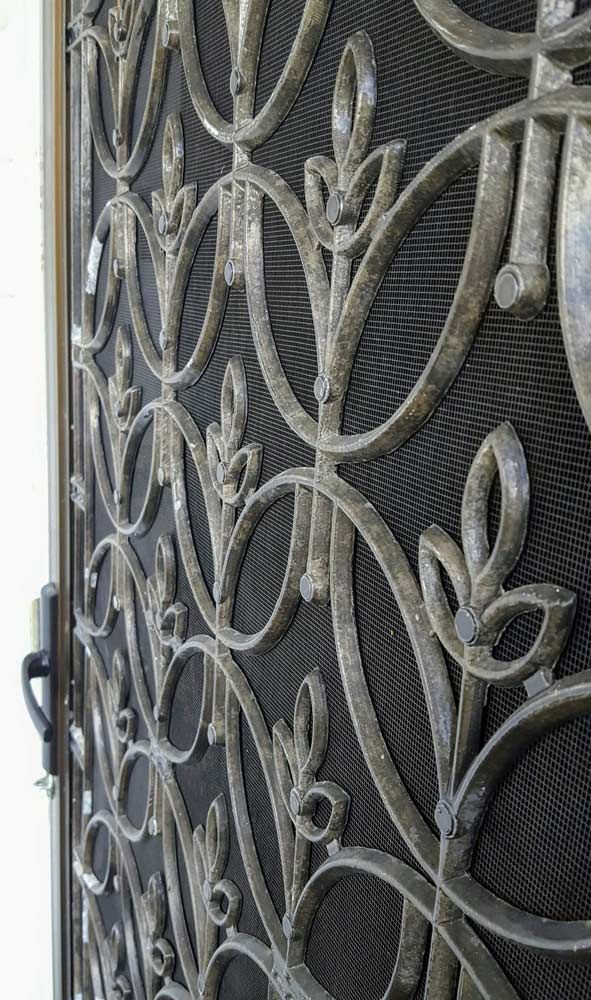 A Close Up Of A Wrought Iron Door With A Pattern On It — Smith Aluminium In Merewether, NSW