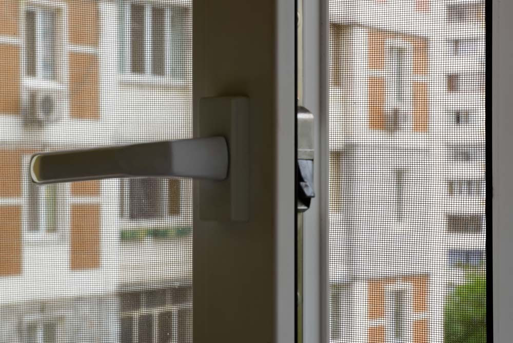 A Close Up Of A Door With A Flyscreen — Smith Aluminium In Mayfield, NSW