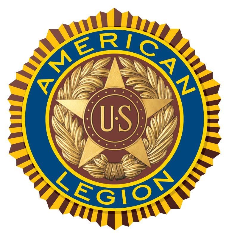 American Legion emblem in blue, gold, and red with a central “US” shield and laurel wreath