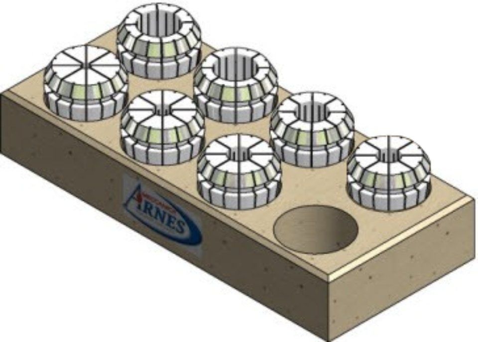 Wooden base with six metal die set holders and one empty circular hole on top.
