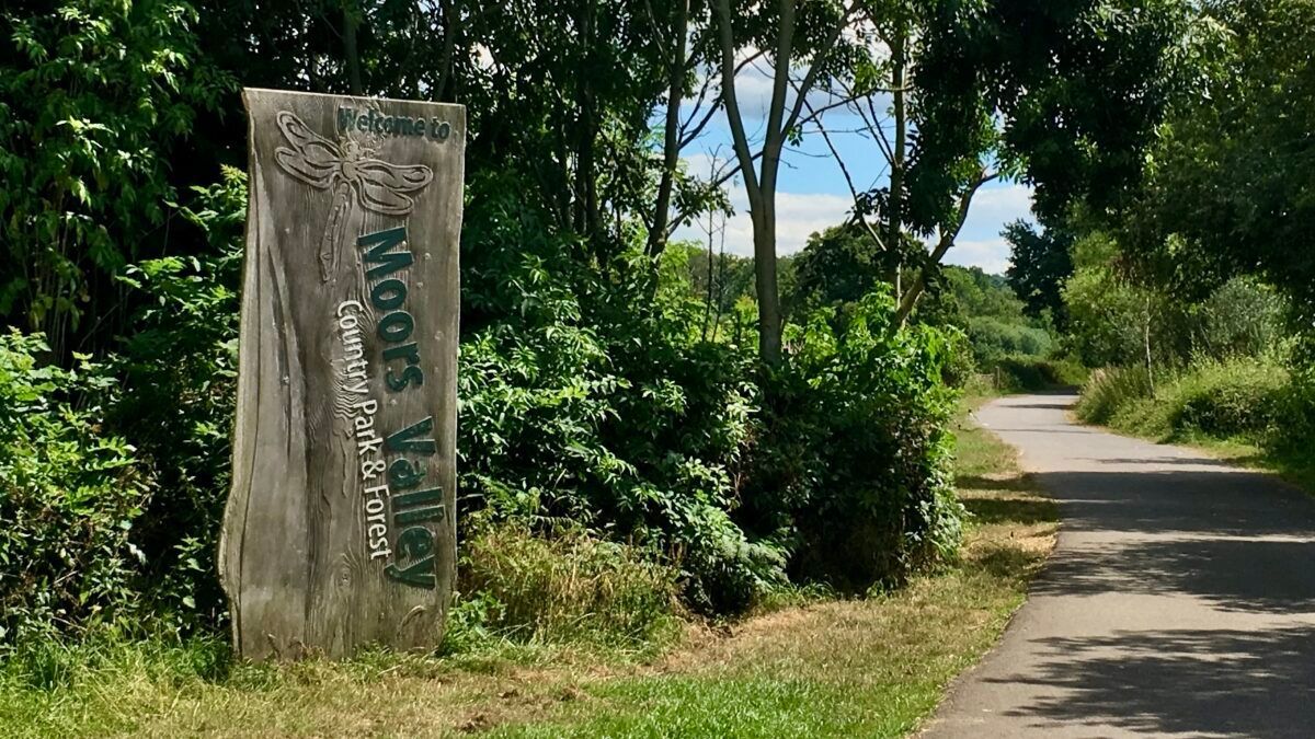 A wooden sign that reads