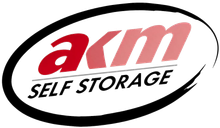 AKM Self Storage logo in red and black inside an oval outline
