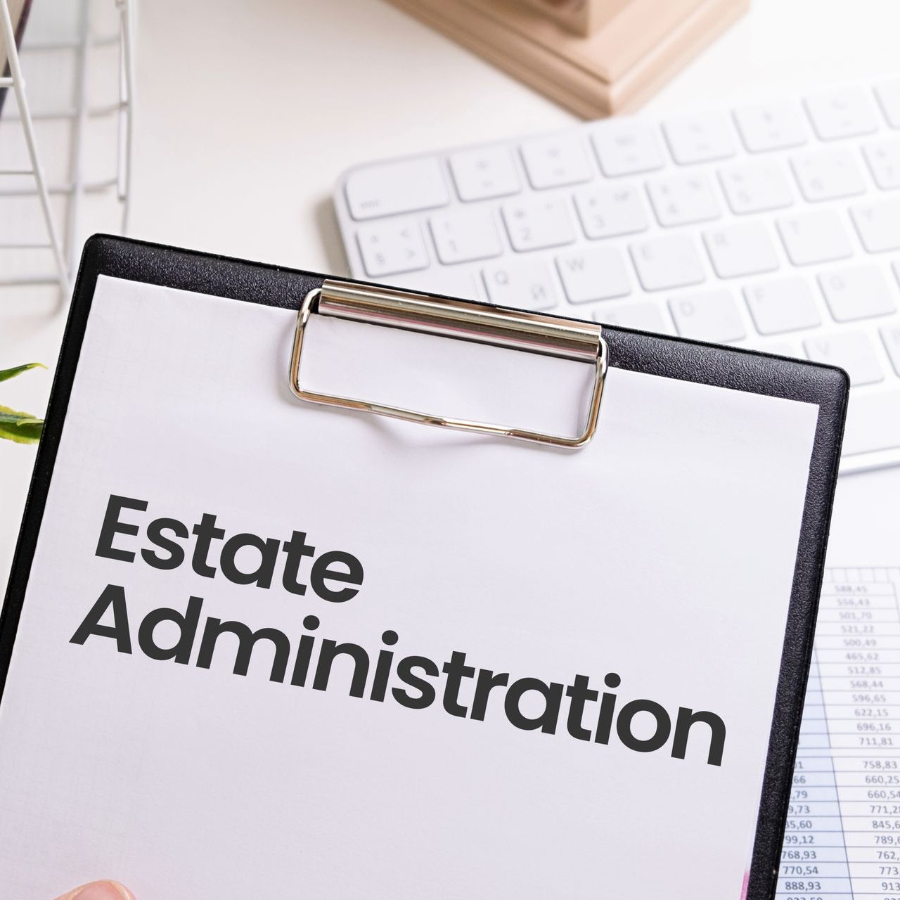 A clipboard with estate administration written on it