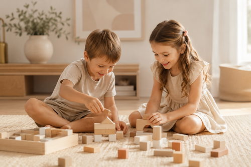Two children playing with wooden blocks, representing family law support at Airlie Legal