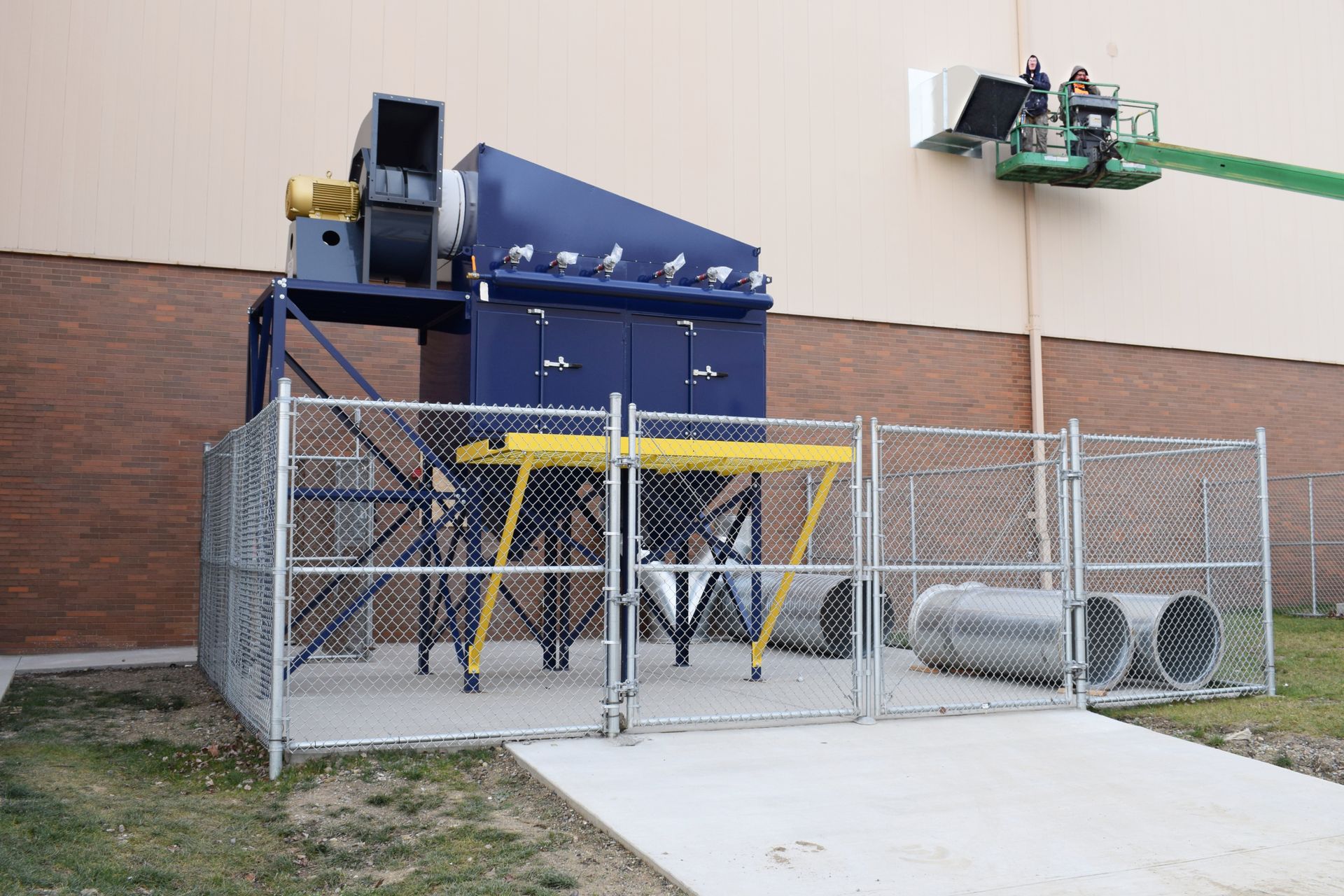 Outdoor VES dust collector installation with fenced work area