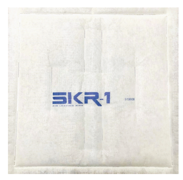 White square package with the blue letters