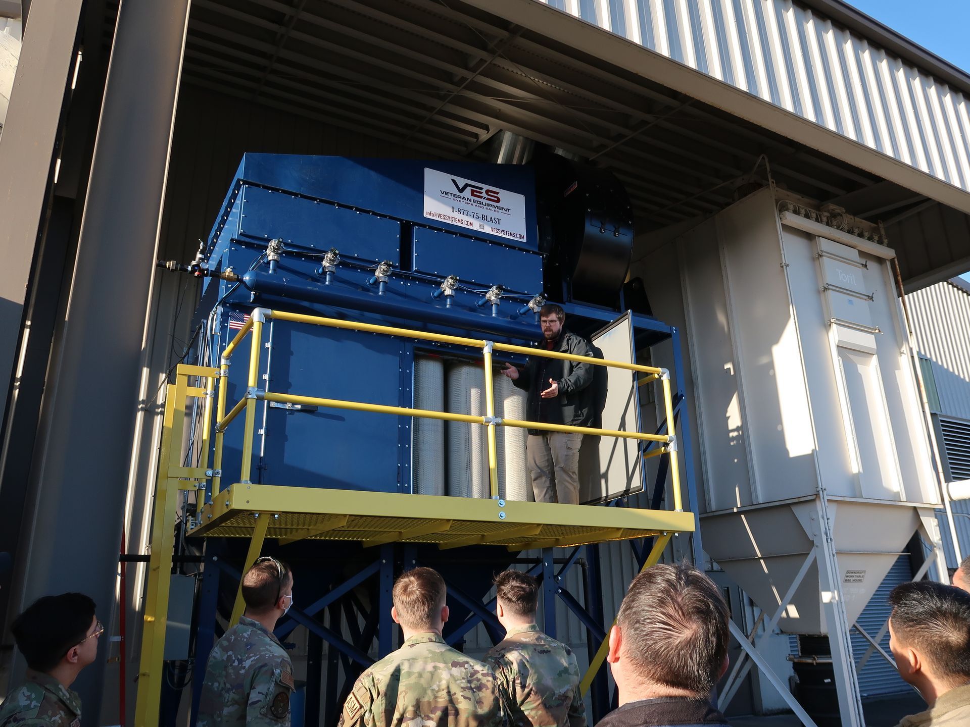 Outdoor VES dust collection system with military being trained