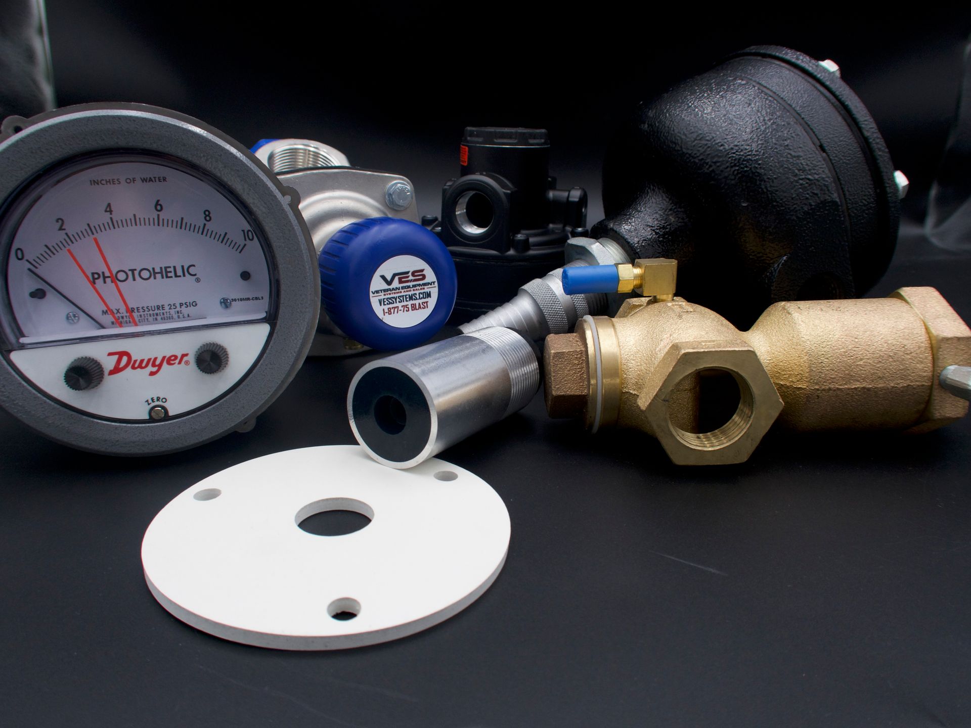 Pressure gauge, valves, and regulator parts.