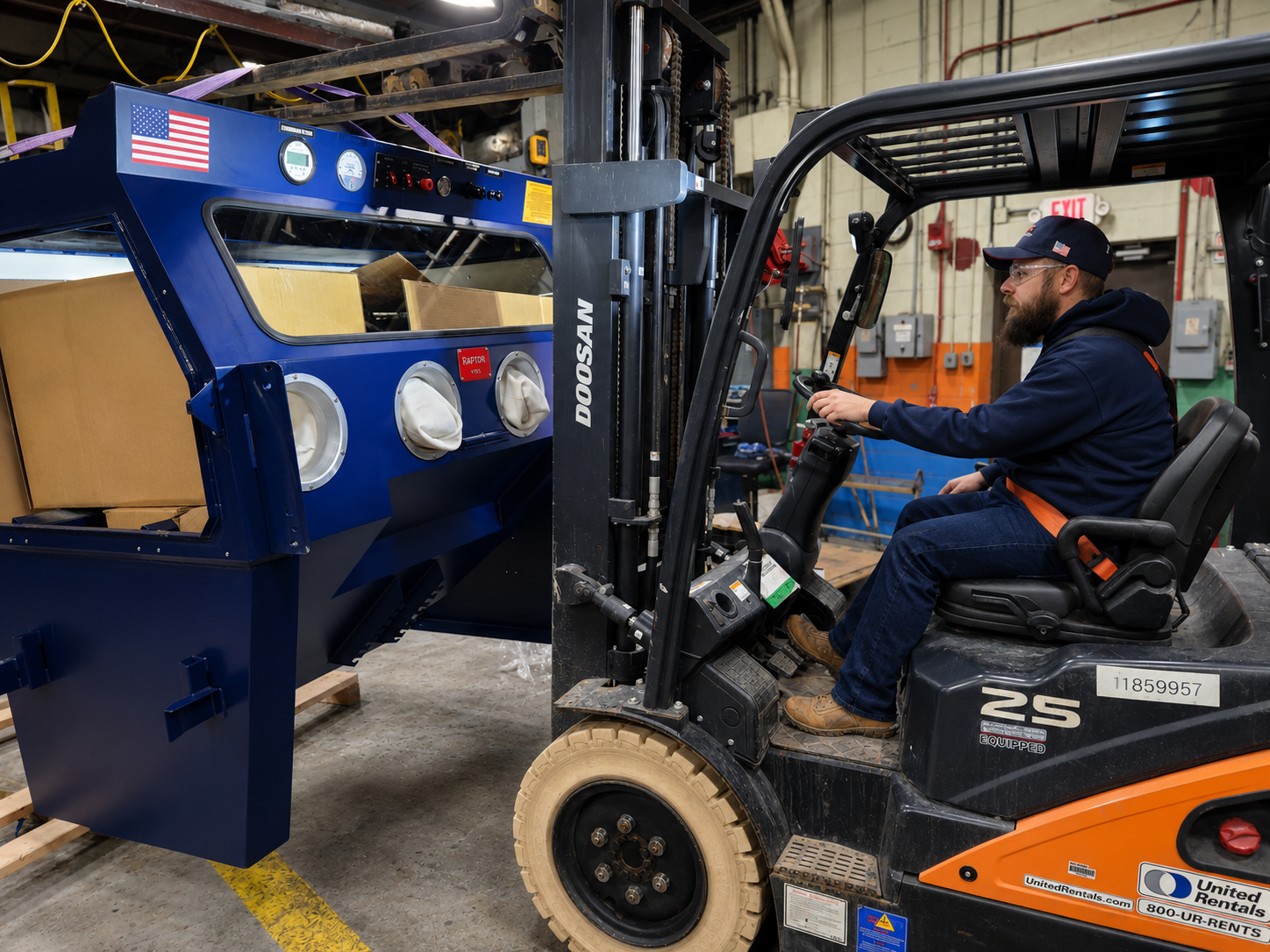 VES operator listing VES blast cabinet with forklift