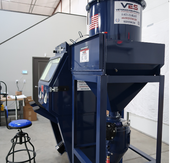 Side view of VES Viper Series blast cabinet with integrated dust collector and ergonomic operator seating