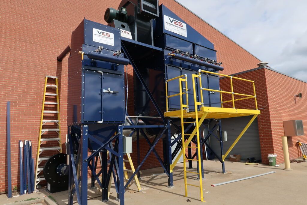 Outdoor VES dust collection system with access platform.