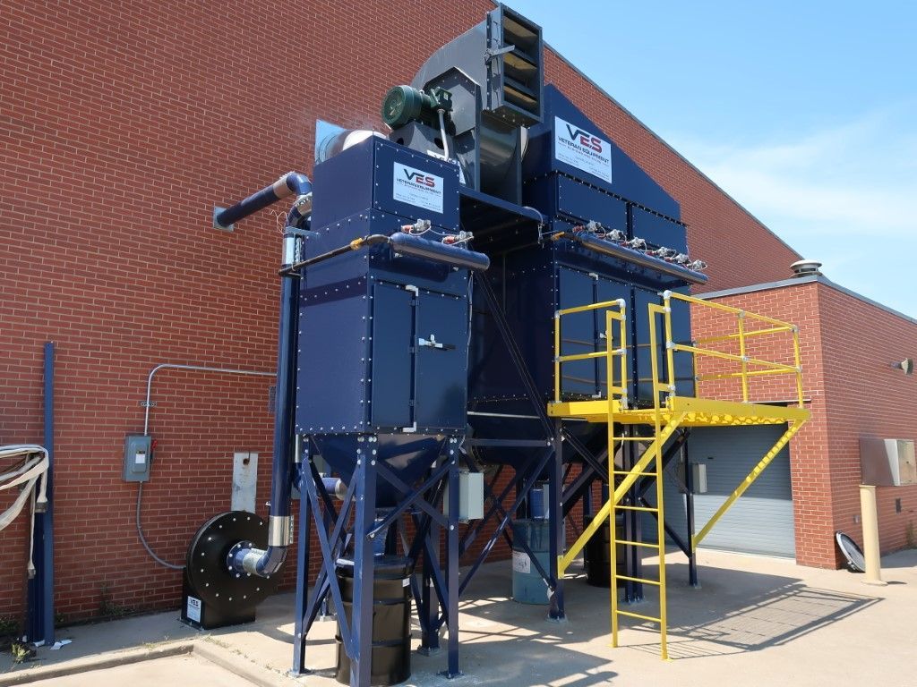 Blue VES dust collector installed on the outside of a building