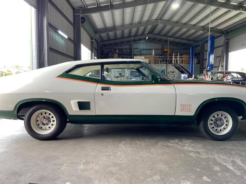 Classic White and Green Muscle Car Parked Inside a Garage — Mareeba Motors In Mareeba, QLD
