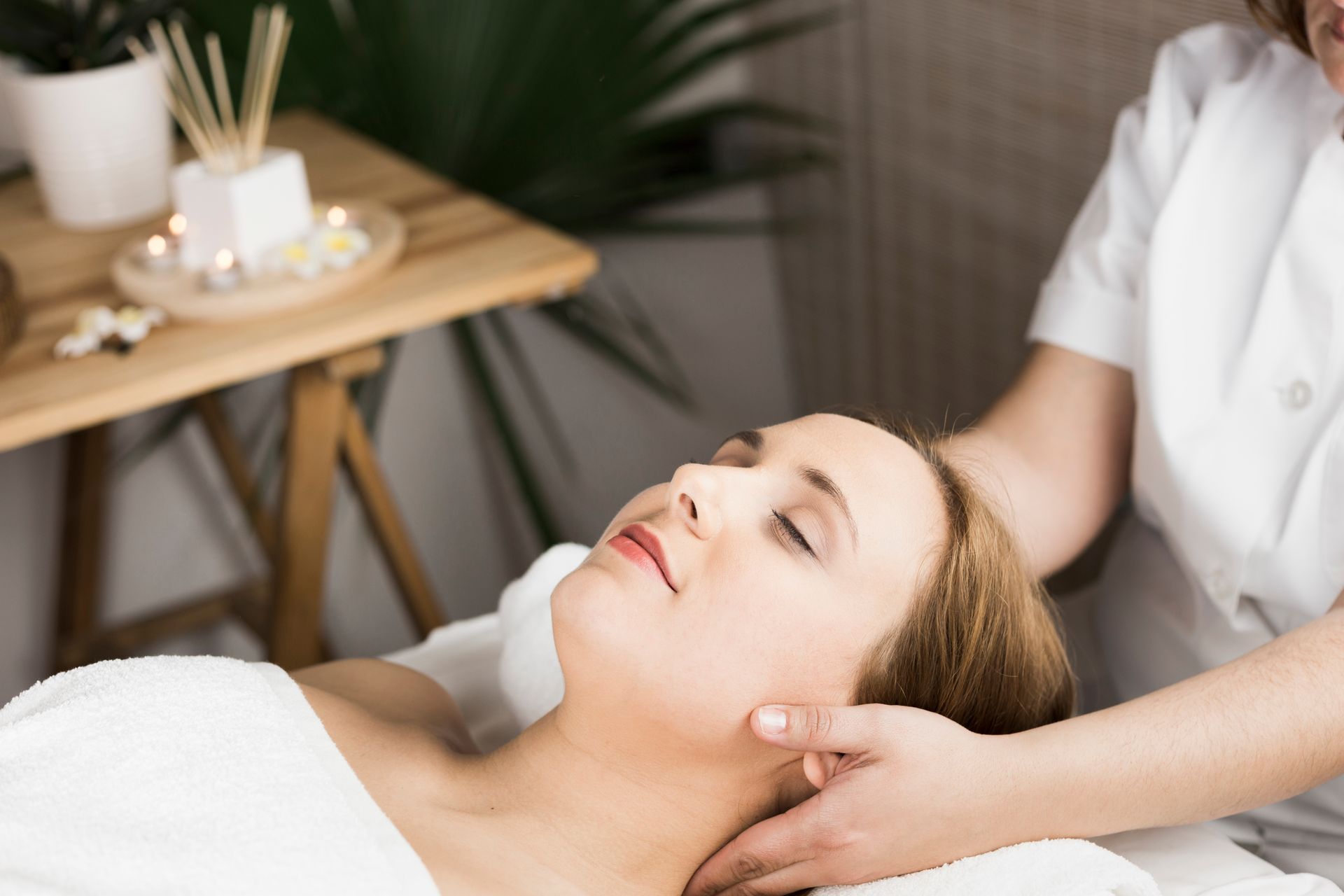 A woman is getting a massage at a spa.