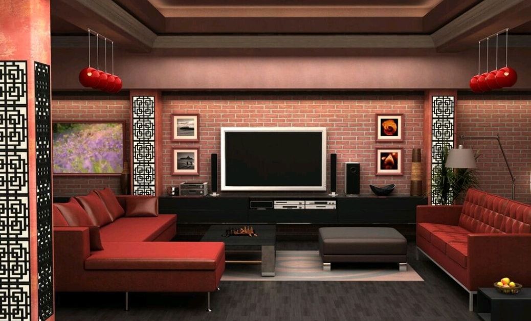 Stylish red-and-black modern living room with a large TV and symmetrical decor