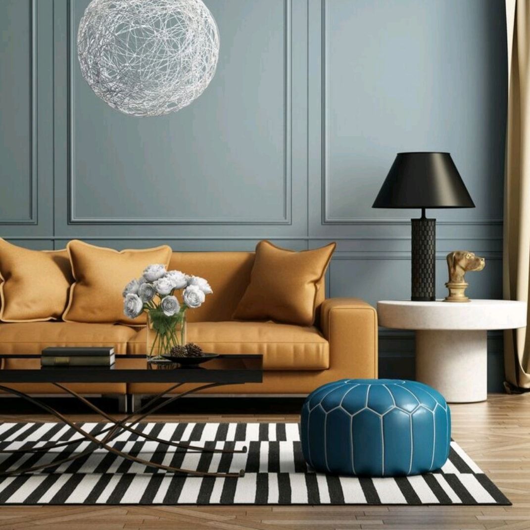 Stylish living room with mustard sofa, blue ottoman, black-and-white rug, and modern decor