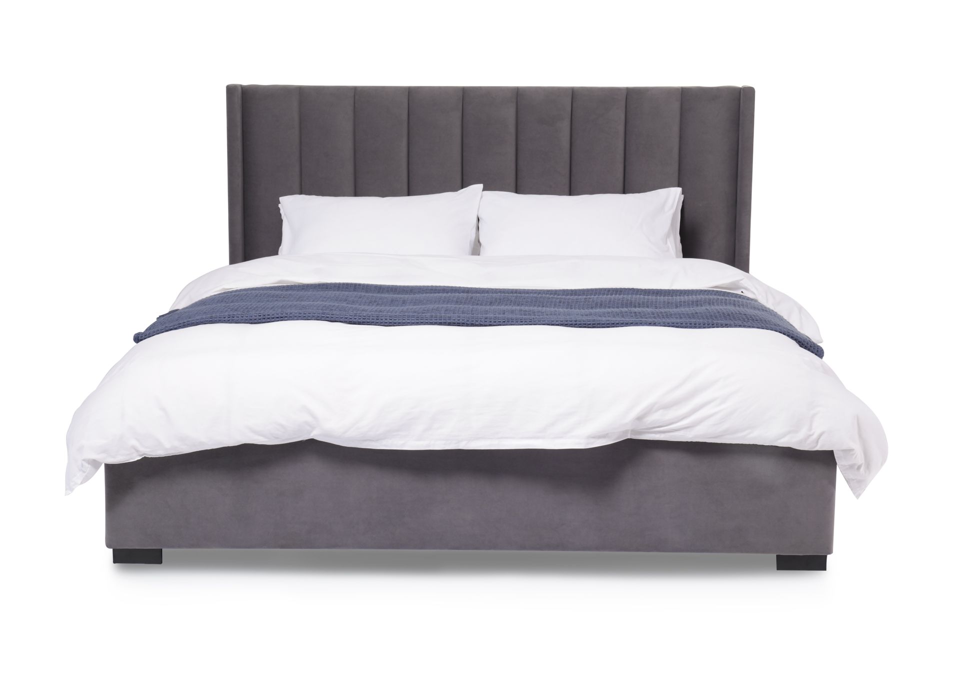 Modern gray upholstered bed with white bedding and vertical panel headboard