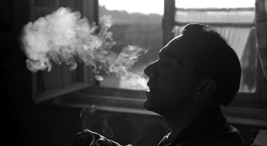 man smoking in a room