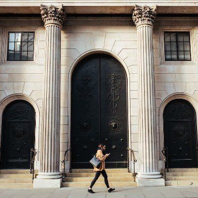 Person passing in front of a bank