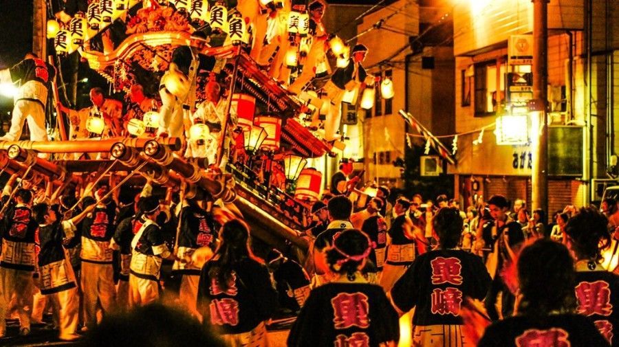 Japanese parade with traditional Japanese parade float.