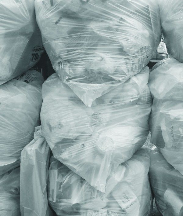 Trash in white plastic trash bags