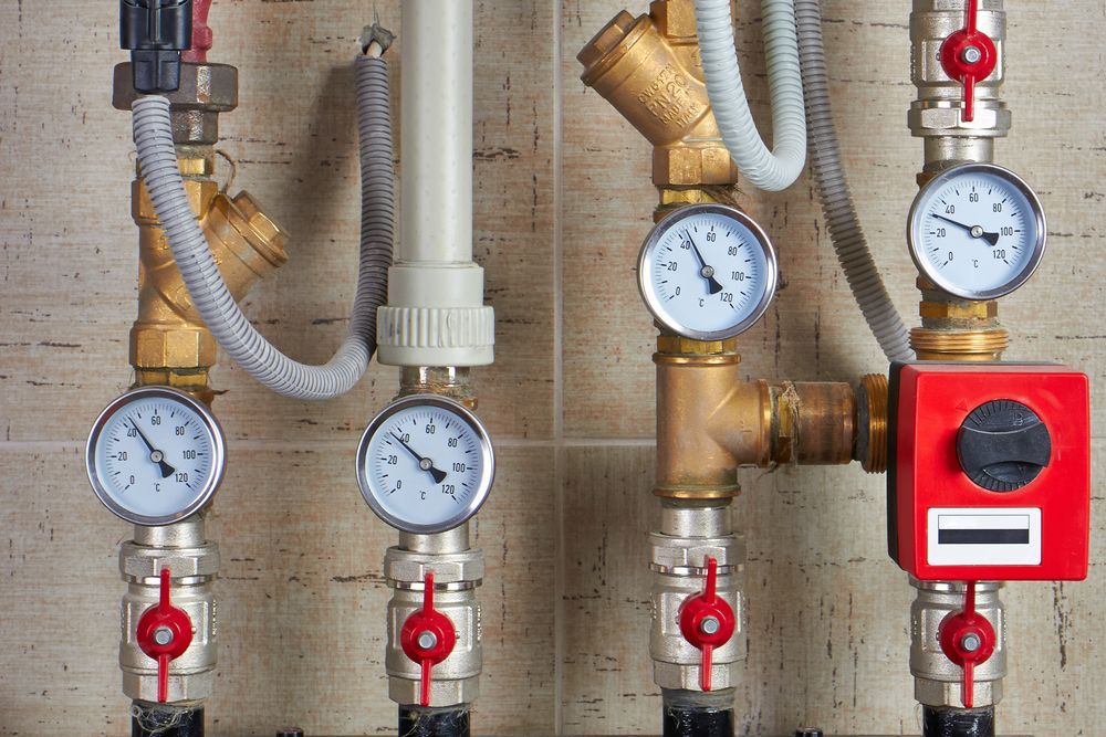Close-up of Gas Pipes With Pressure Gauges and Valves — Waves Plumbing in Central Coast, NSW