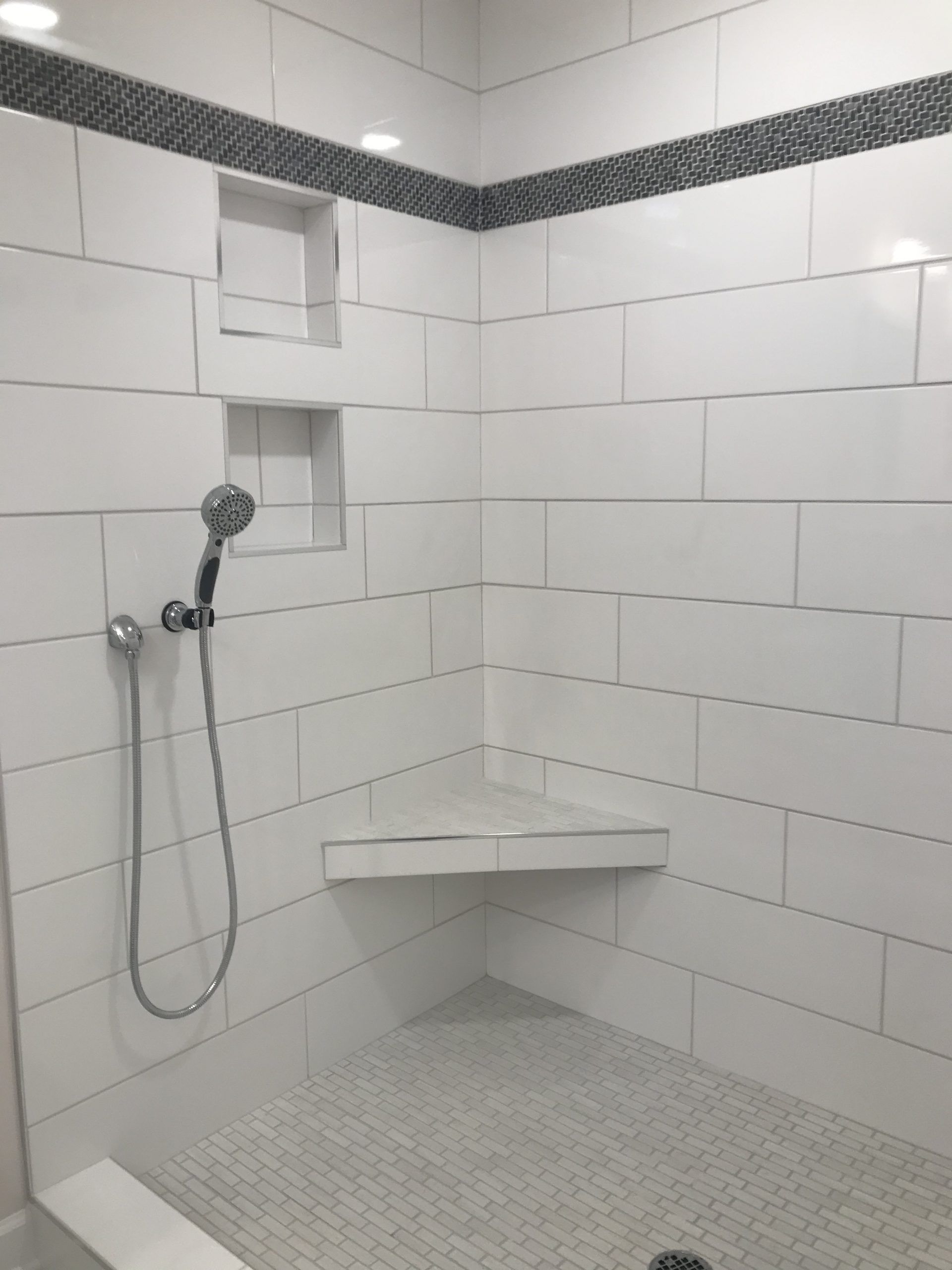 A Shower with A Corner Bench and A Shower Head | Tonao, VA | Don Kendrick