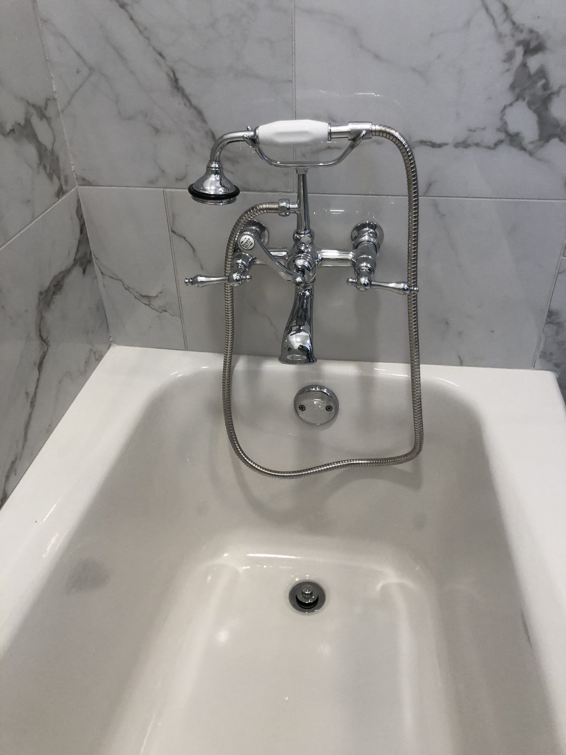 A Bathtub with A Shower Head Attached to It | Tonao, VA | Don Kendrick
