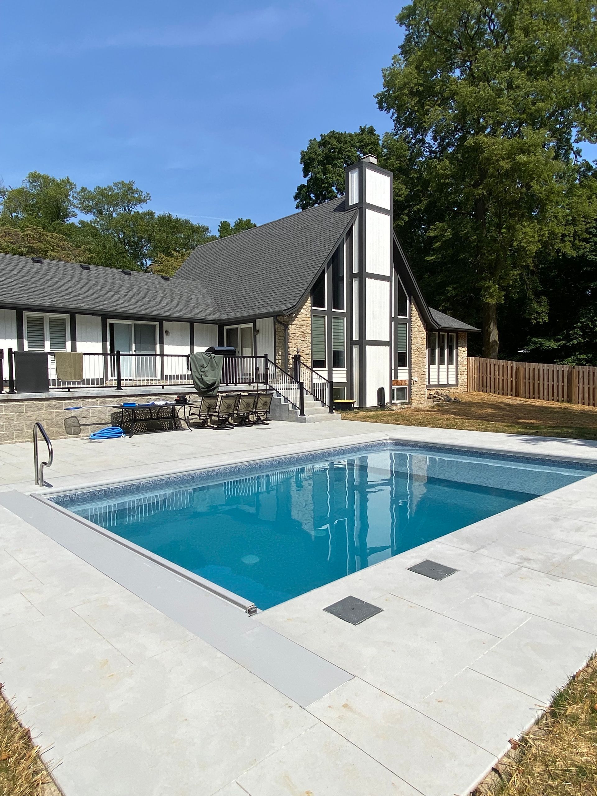 A swimming pool with a blue and white design on the side