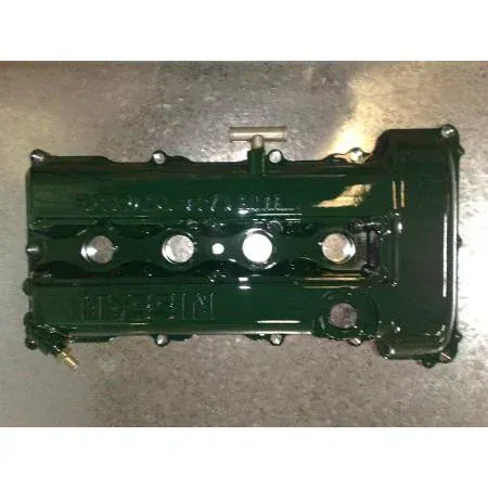 Green painted Nissan engine valve cover.